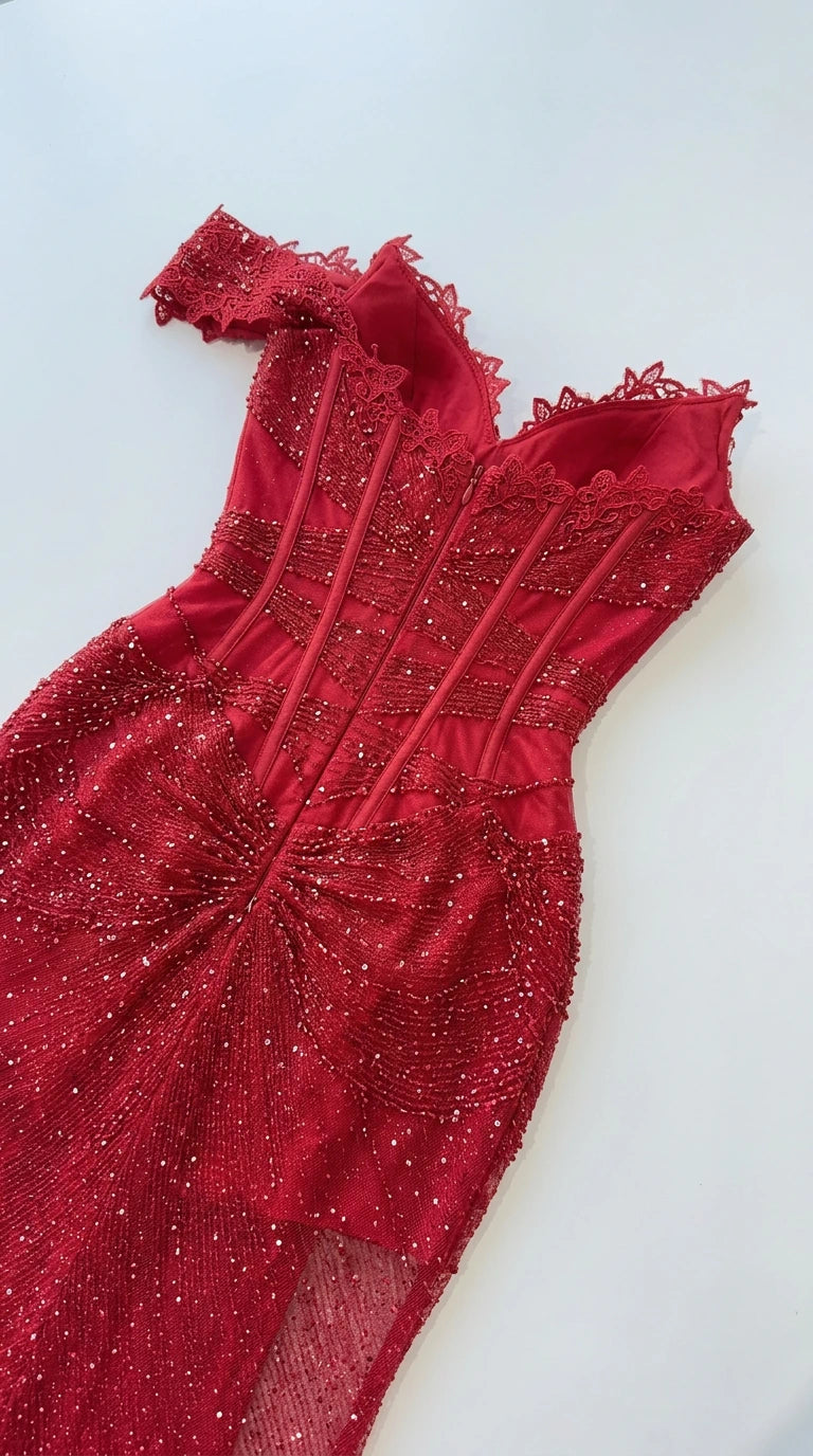 Close-up detail of red corset bodice with boning and sparkling embellishments