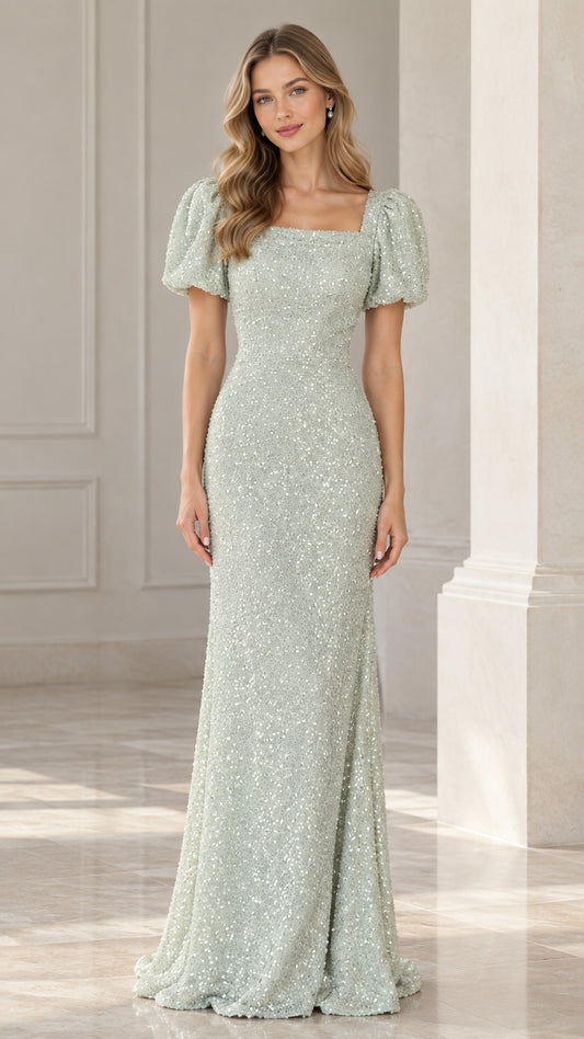 Front view of model wearing floor-length sage green sequin evening gown with puff sleeves and square neckline