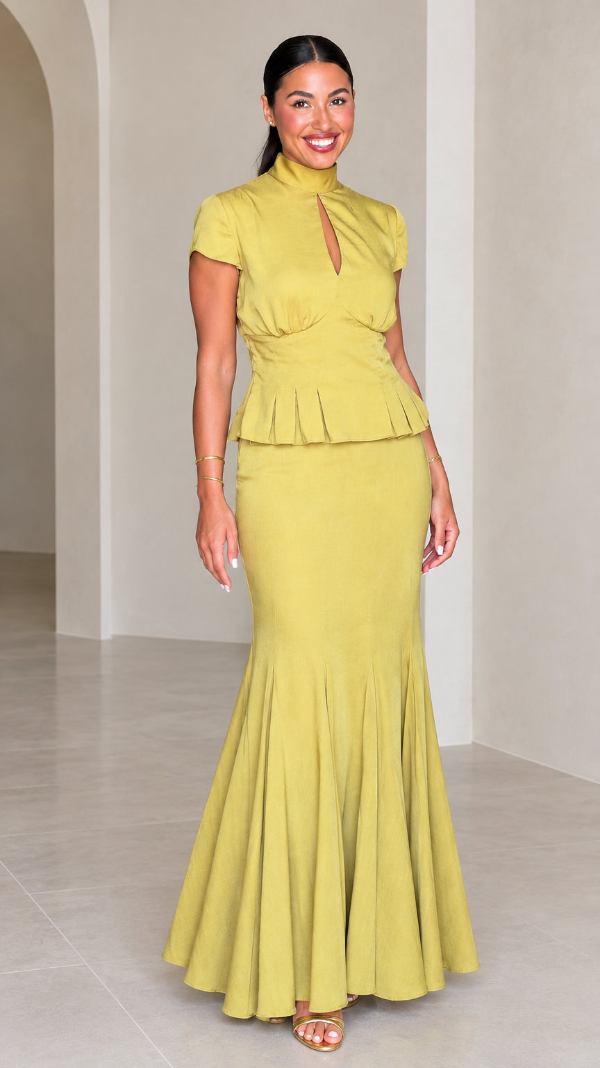 Front full-length view of woman wearing Chartreuse high neck peplum mermaid maxi dress set