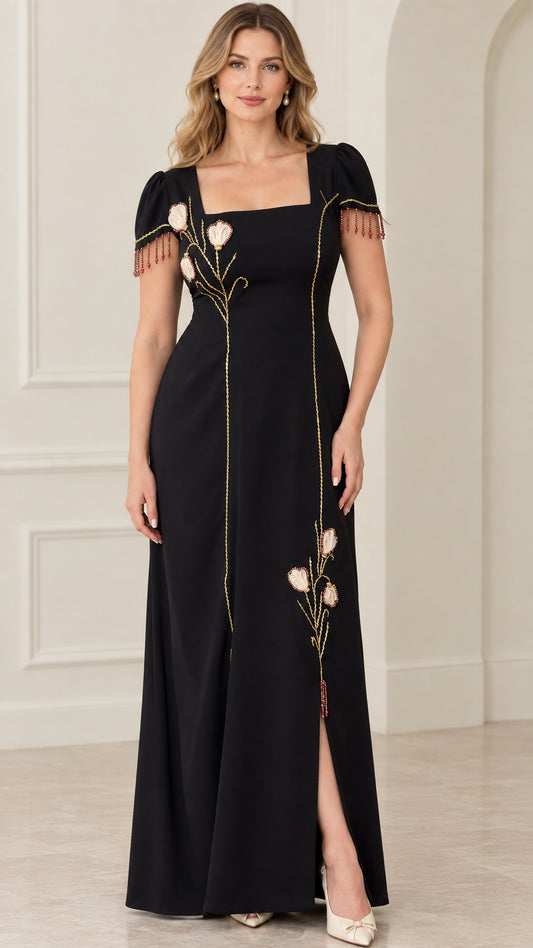 Front view of black square neck maxi dress with floral embroidery and beaded sleeve fringe
