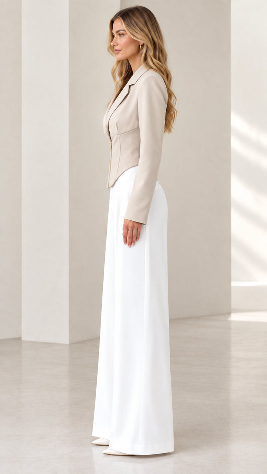 Side view of model wearing a beige tailored corset jacket