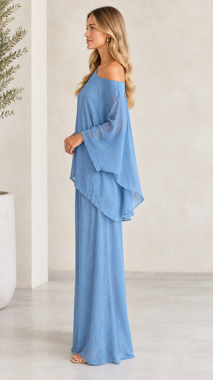 Side view of woman wearing Dusty Blue flowing two-piece pant set