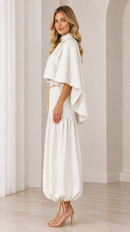 Side profile of ivory capelet top and ruched balloon trousers