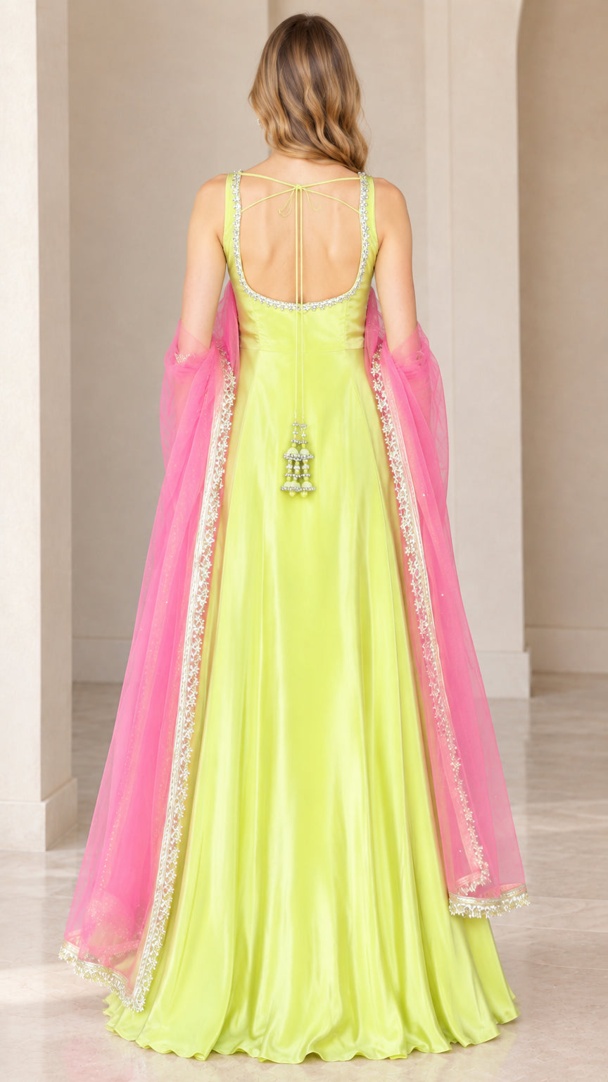 Back view of lime green flared gown showing open back design and beaded tie tassels
