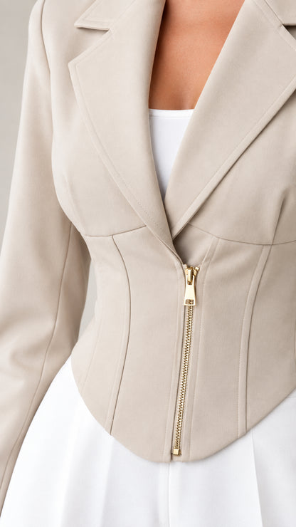 Close-up of beige corset blazer showing notch lapels and front zip closure