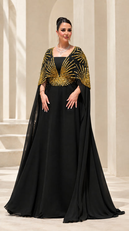 Black formal evening gown with gold beaded capelet overlay