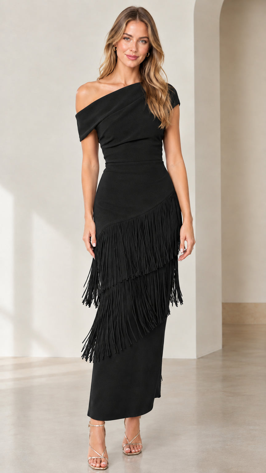 Front view of black one-shoulder tiered fringe midi dress