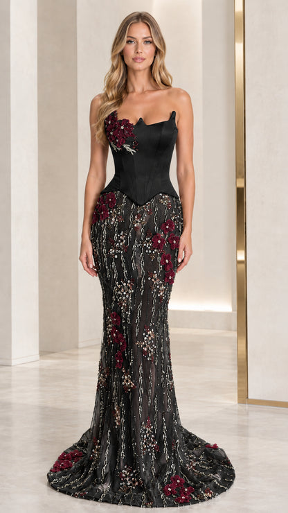 Full-length view of black corset mermaid evening dress with embroidered floral skirt